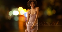 Cute black woman posing with bokeh lights outdoors night scene
