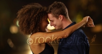 Close up portrait of couple holding each other outdoors