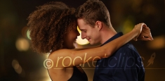 Close up portrait of couple holding each other outdoors