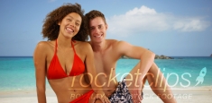 Attractive interracial friends posing on Caribbean beach.
